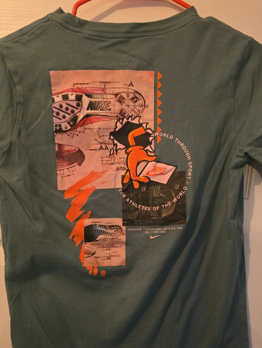 Nike Kids Green Graphic Tee with Orange Logo